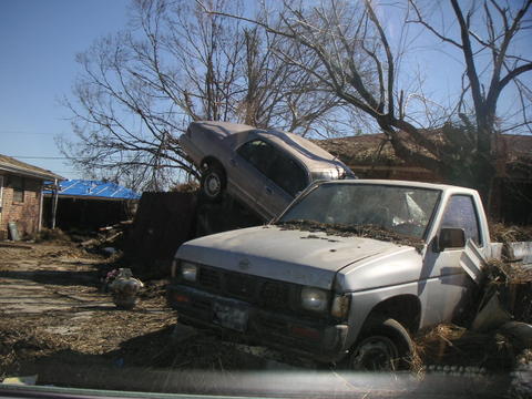 A lot of cars and debris have been picked up, but many still remain.