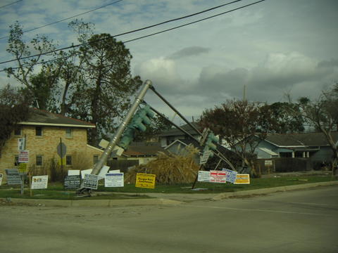 Signs fill street corners for house 